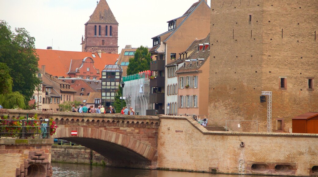 Covered Bridge featuring a river or creek, a small town or village and a bridge