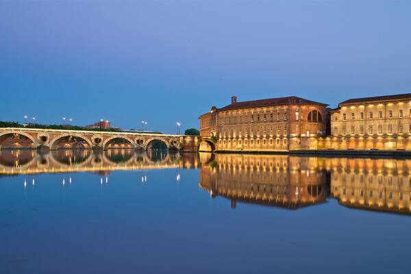 Pont Neuf featuring night scenes, heritage architecture and a lake or waterhole