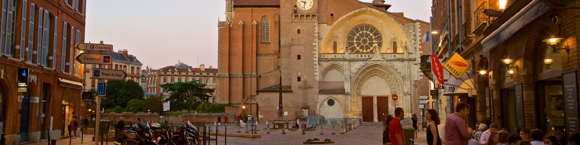 Saint Etienne Cathedrale which includes street scenes, a city and a sunset