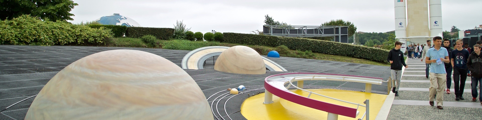 Cite de l\'Espace featuring outdoor art as well as a small group of people