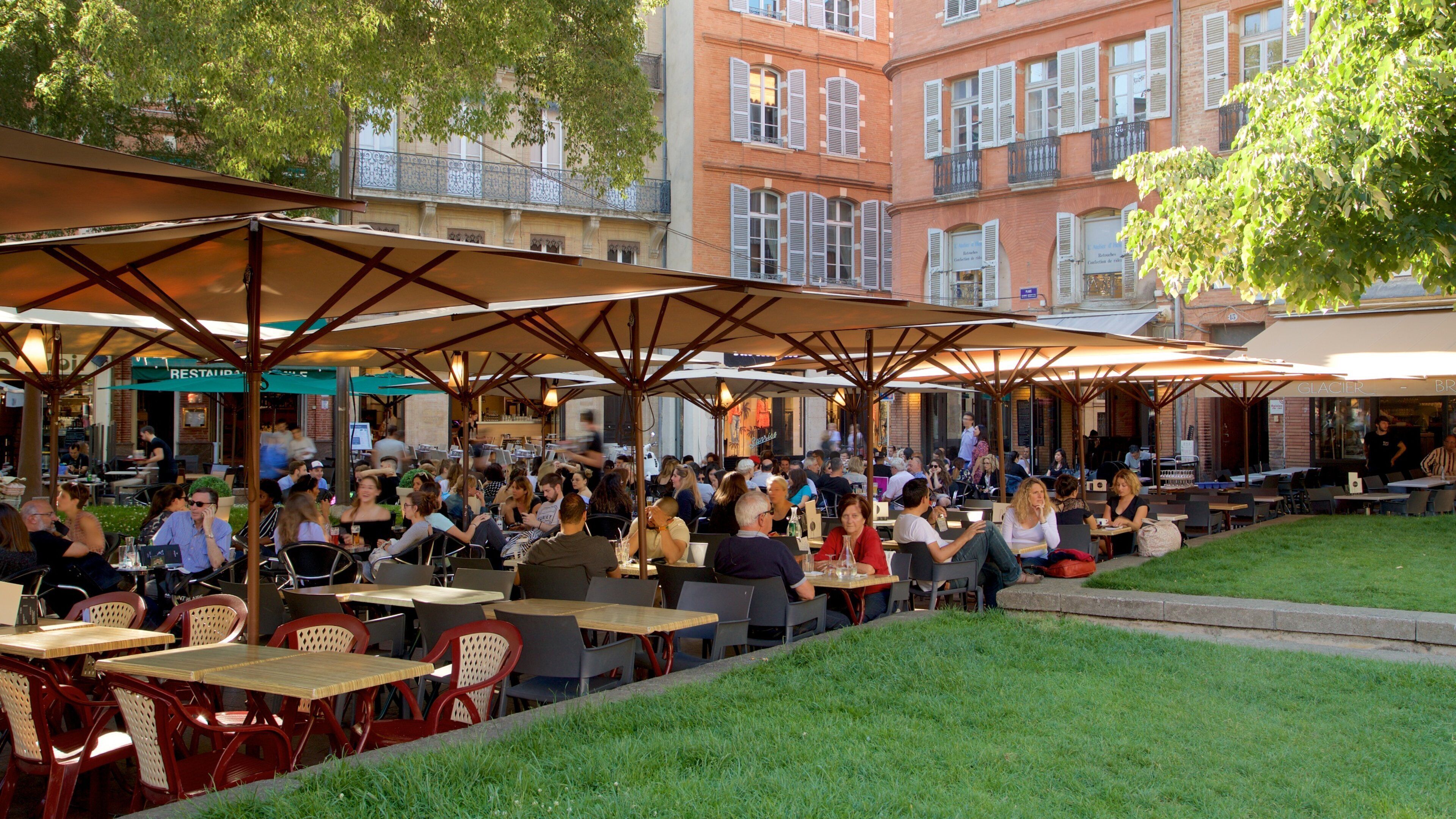 Saint George Place which includes outdoor eating as well as a large group of people