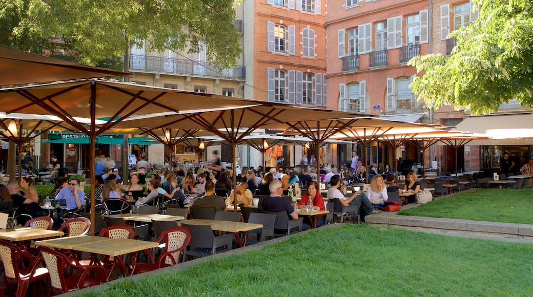 Saint George Place which includes outdoor eating as well as a large group of people