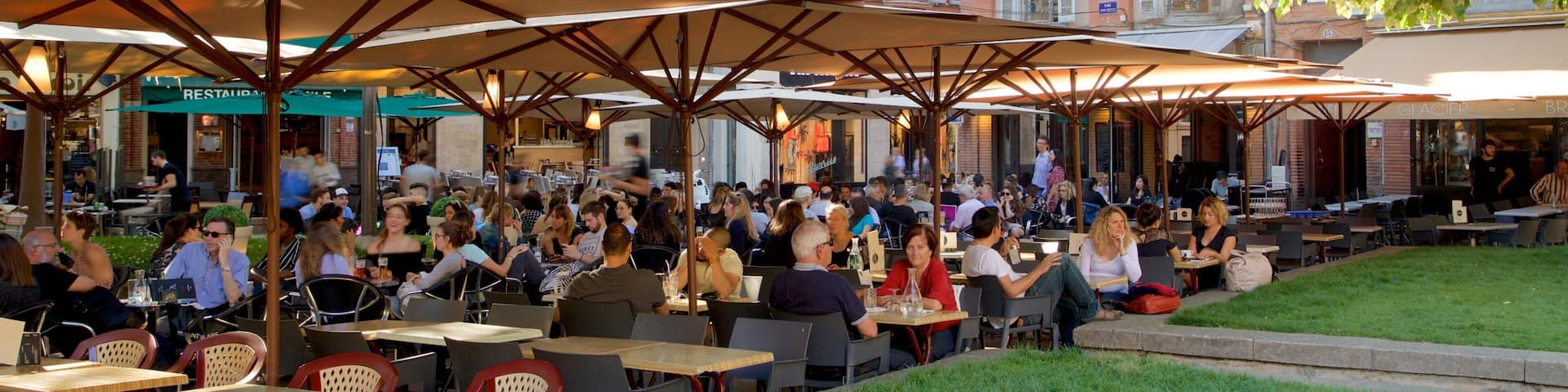 Saint George Place which includes outdoor eating as well as a large group of people