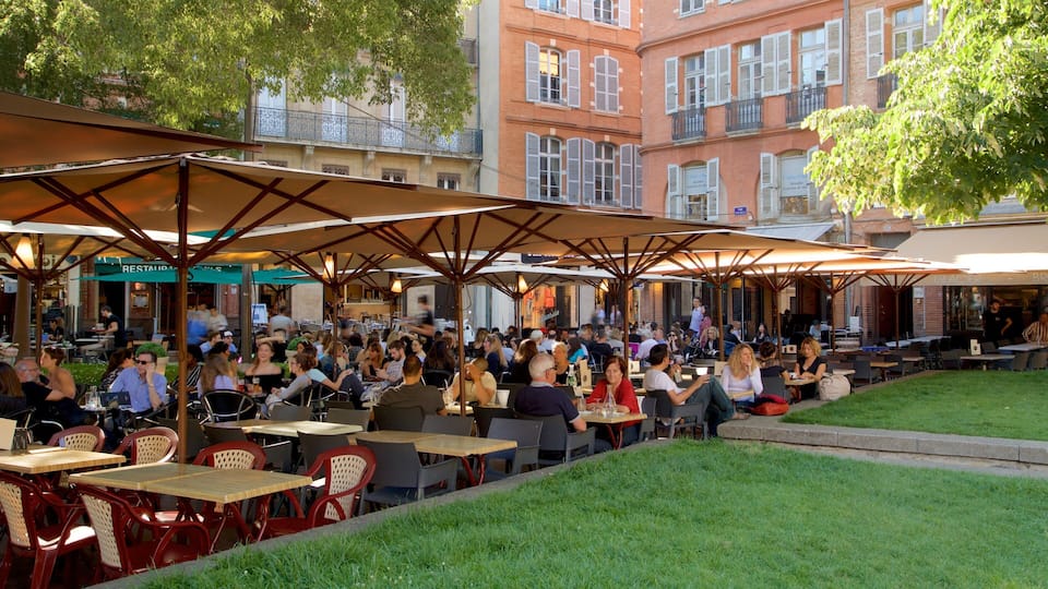 Saint George Place which includes outdoor eating as well as a large group of people