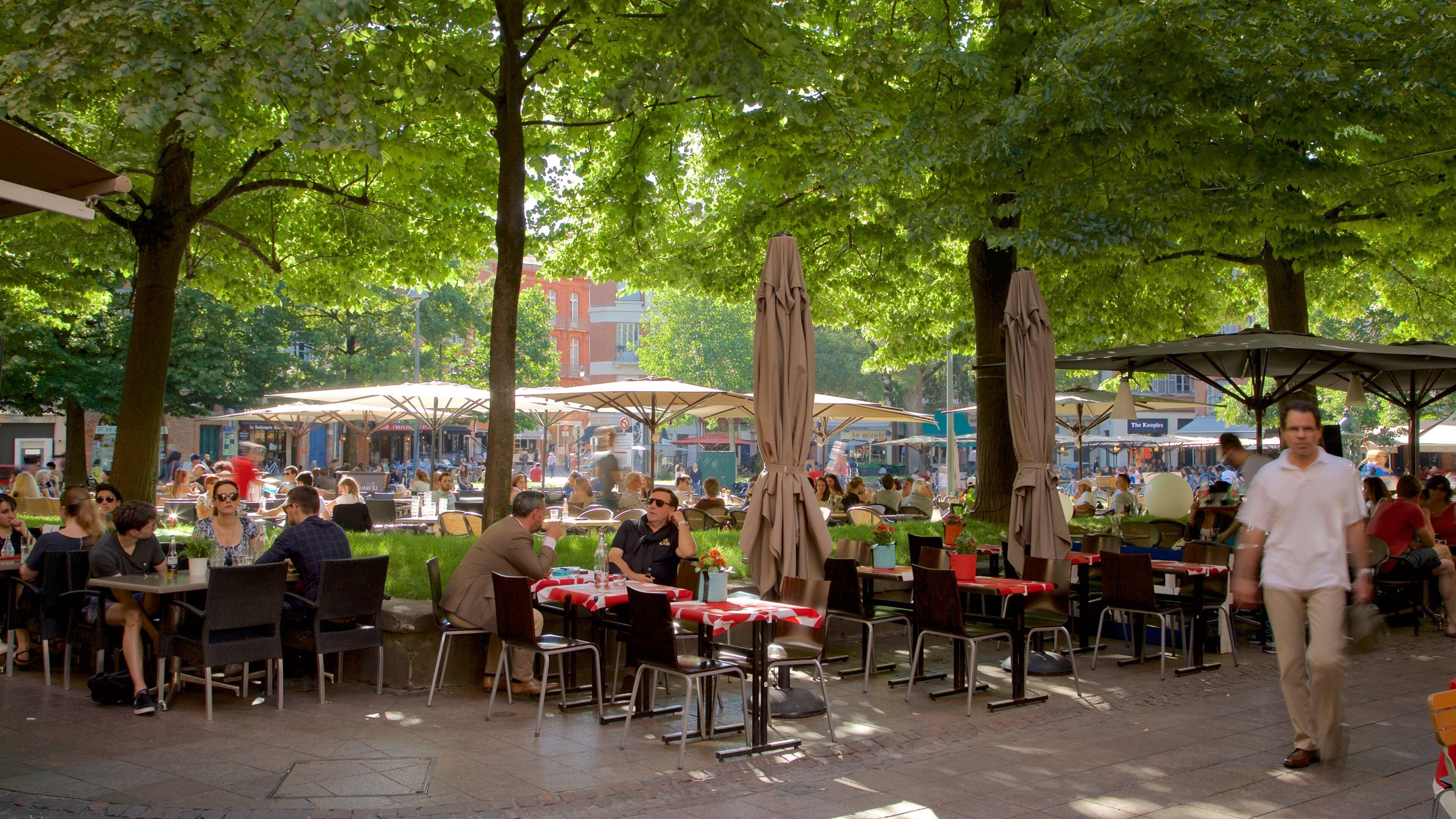 Saint George Place which includes outdoor eating as well as a large group of people