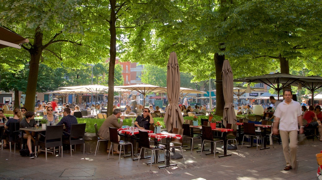 Saint George Place which includes outdoor eating as well as a large group of people
