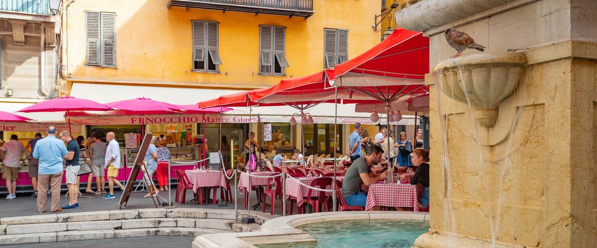 Place Rossetti which includes a fountain and outdoor eating as well as a small group of people