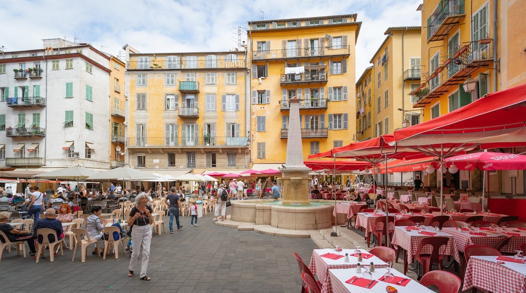Place Rossetti featuring outdoor eating and a fountain as well as a small group of people