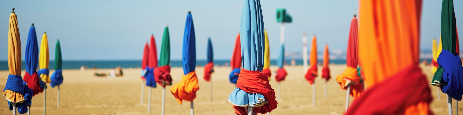 Famous colorful parasols on Deauville Beach, Normandy, Northern France, Europe