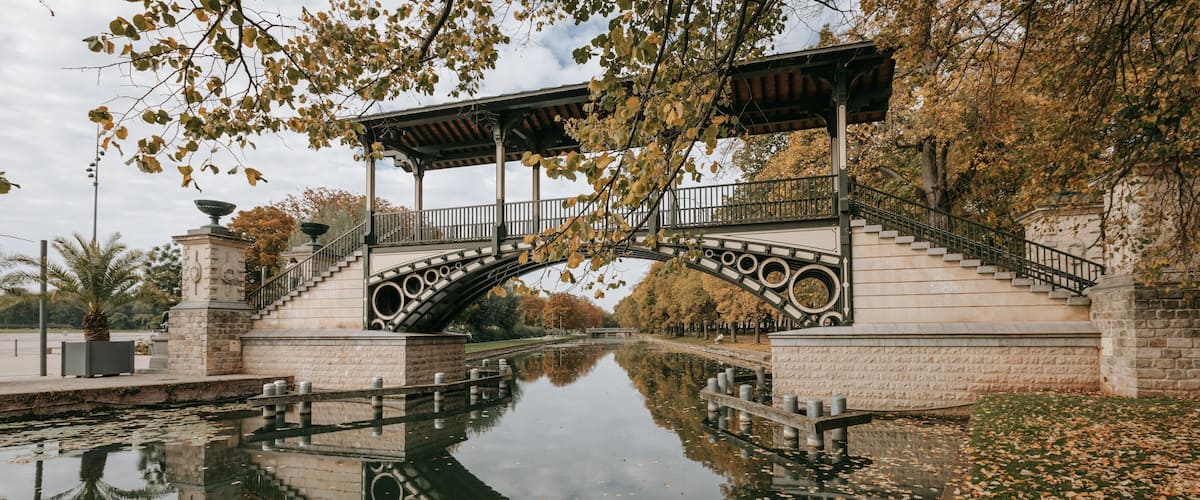Citadel of Lille which includes a river or creek, autumn leaves and a park