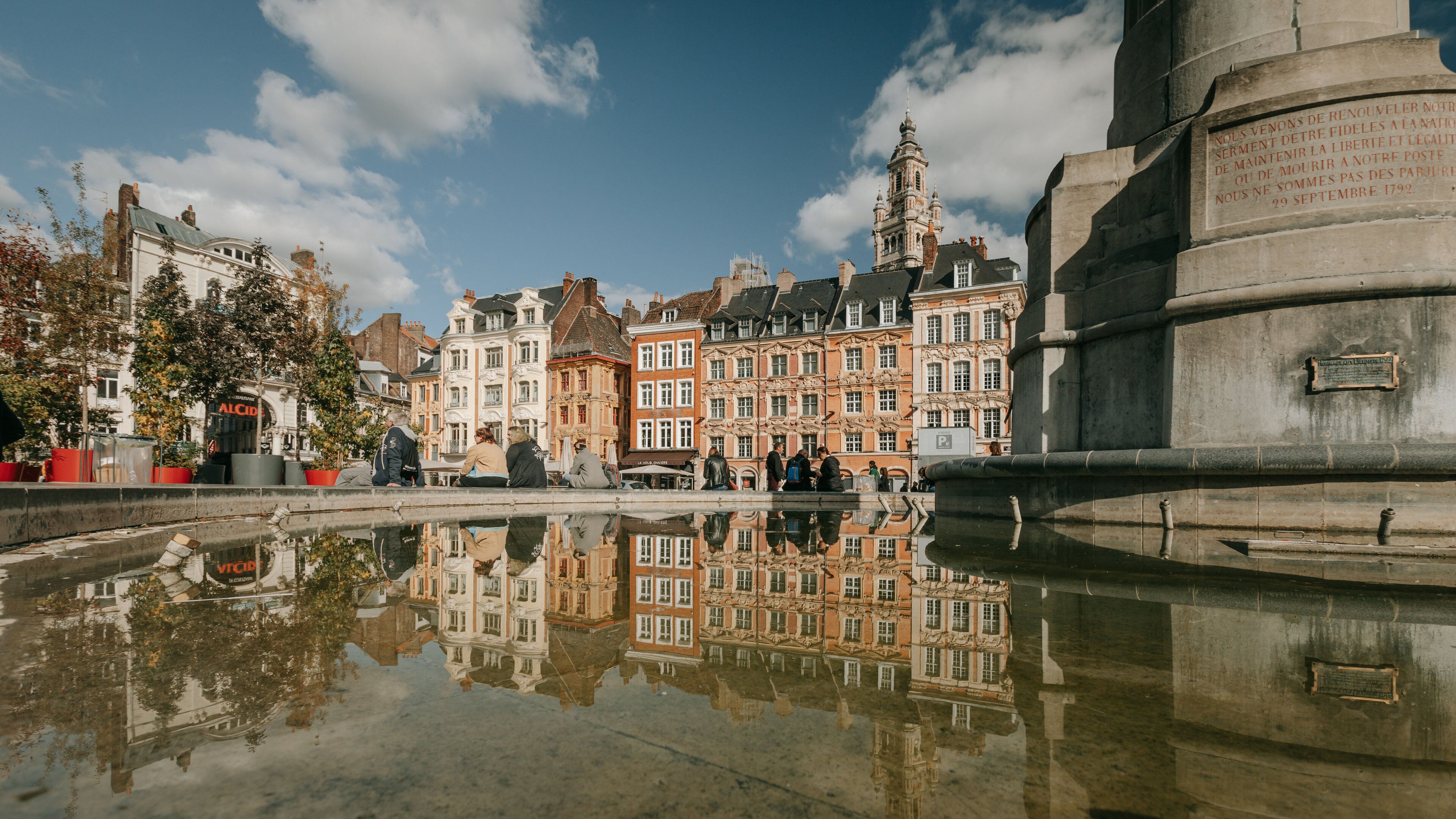 Lille Grand Square featuring a city, a fountain and heritage architecture