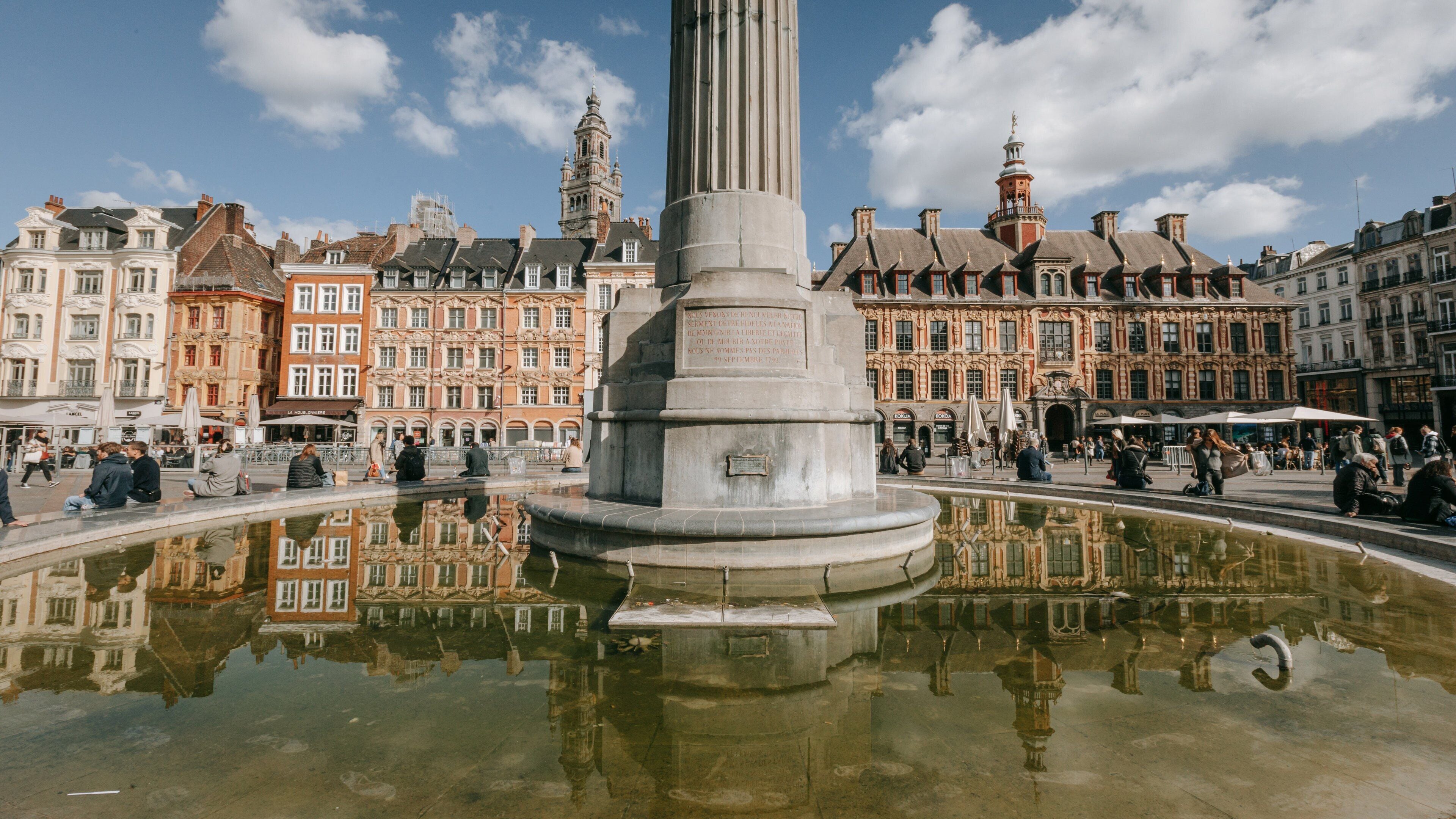Lille Grand Square showing a fountain, a city and heritage architecture