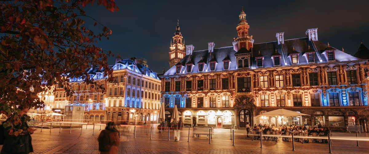 Lille Grand Square showing a city, night scenes and heritage architecture