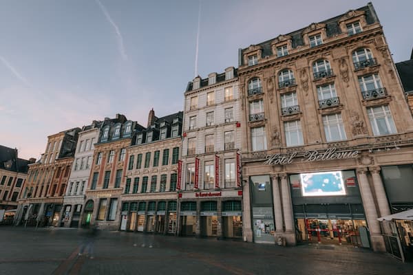 Lille Grand Square showing a city, a sunset and heritage architecture
