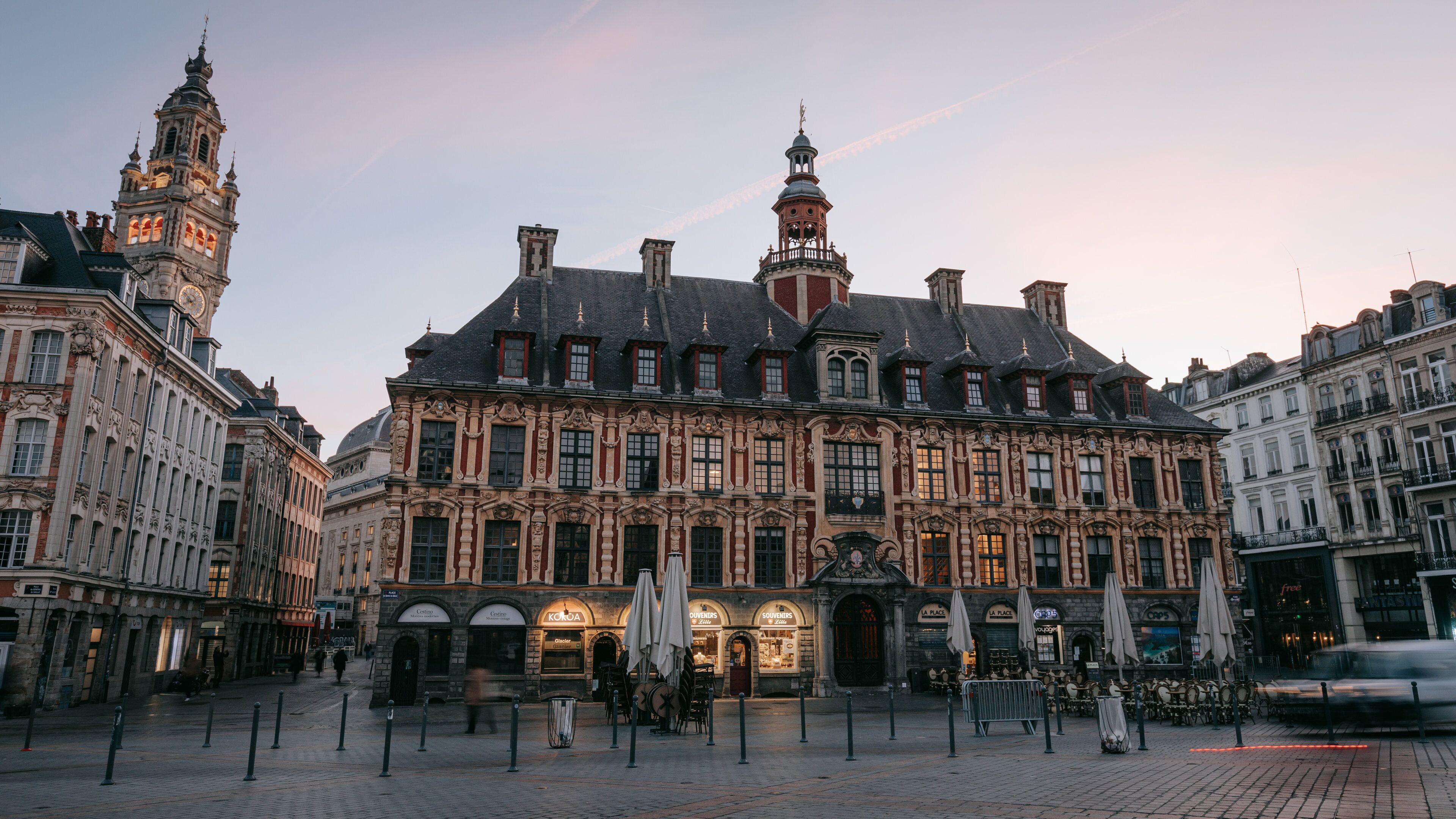 Lille Grand Square featuring heritage architecture, a sunset and a city