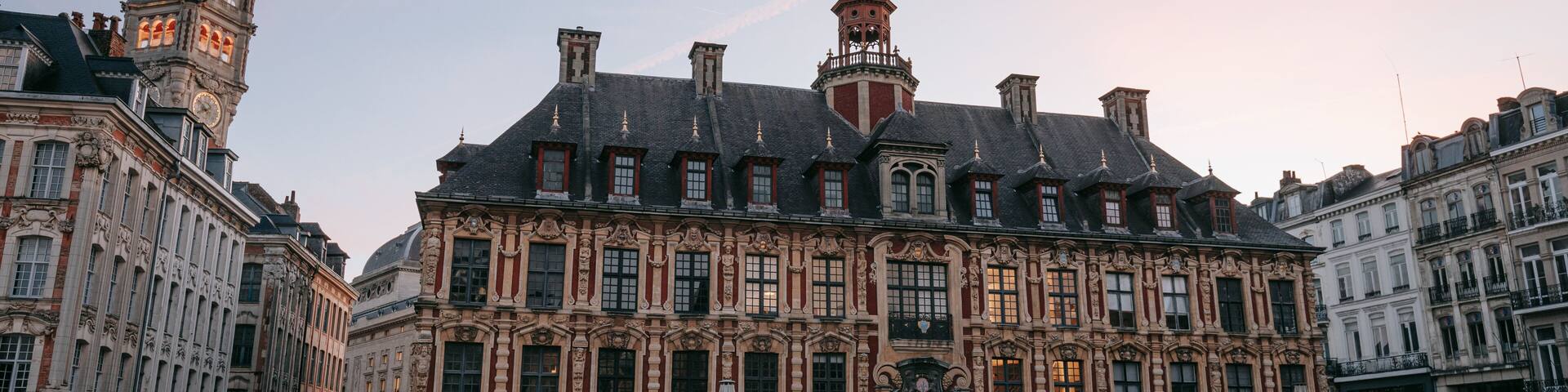 Lille Grand Square featuring heritage architecture, a sunset and a city