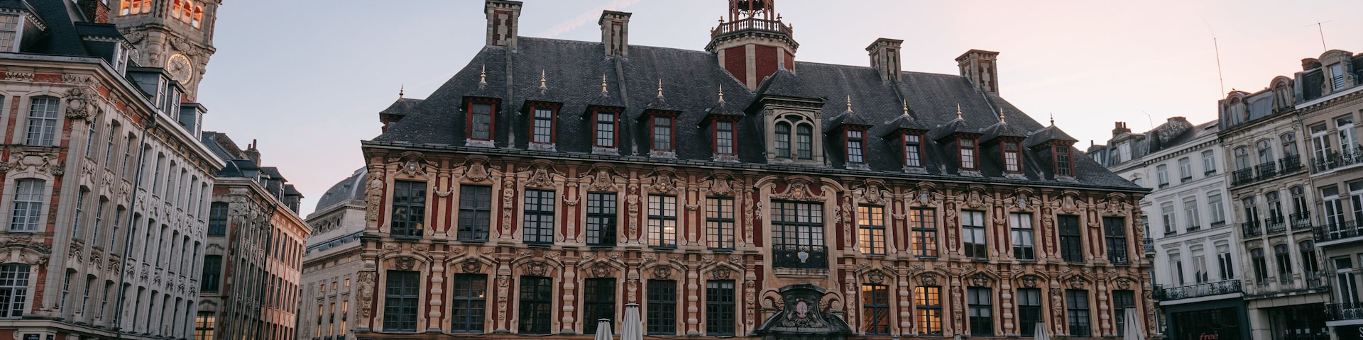 Lille Grand Square featuring heritage architecture, a sunset and a city