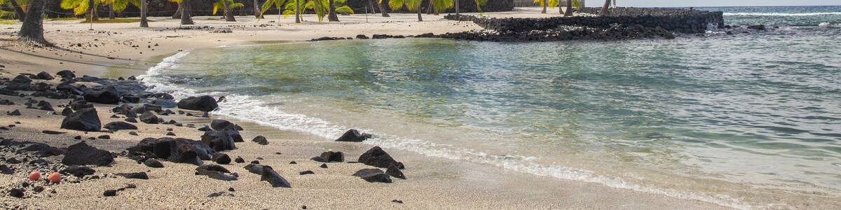 Pu\'uhonua o Honaunau National Historical Park featuring general coastal views, a sandy beach and tropical scenes
