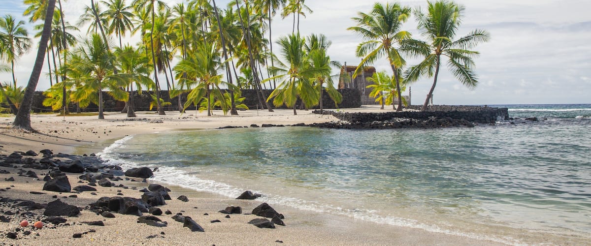 Pu\'uhonua o Honaunau National Historical Park featuring general coastal views, a sandy beach and tropical scenes