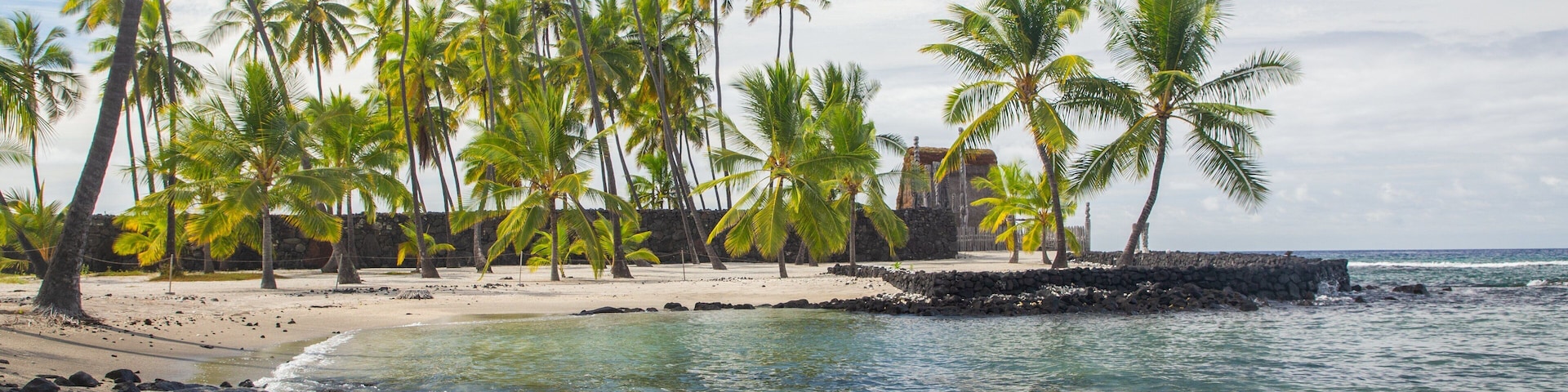 Pu\'uhonua o Honaunau National Historical Park featuring general coastal views, a sandy beach and tropical scenes