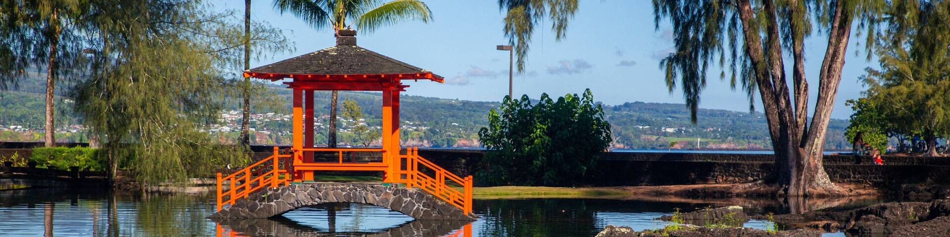 Liliuokalani Park and Gardens featuring a pond
