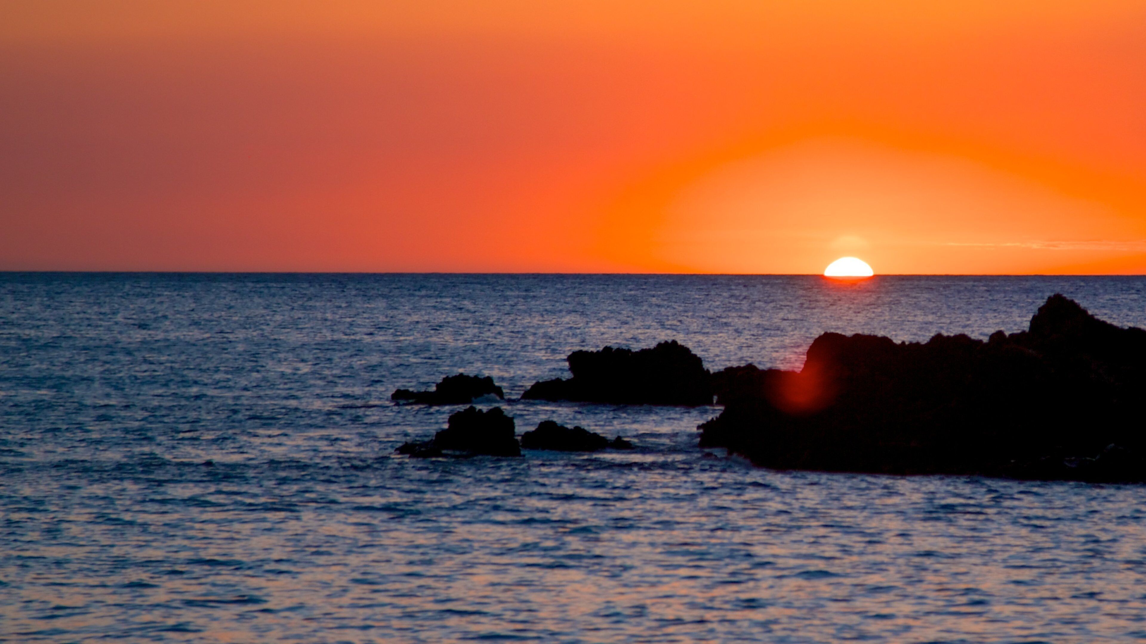Hapuna Beach State Park showing a sunset and general coastal views