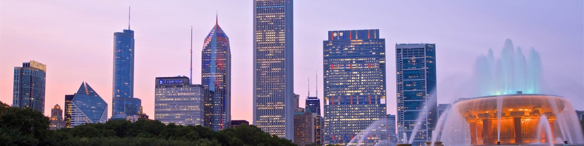 Buckingham Fountain featuring a sunset, a high rise building and a city