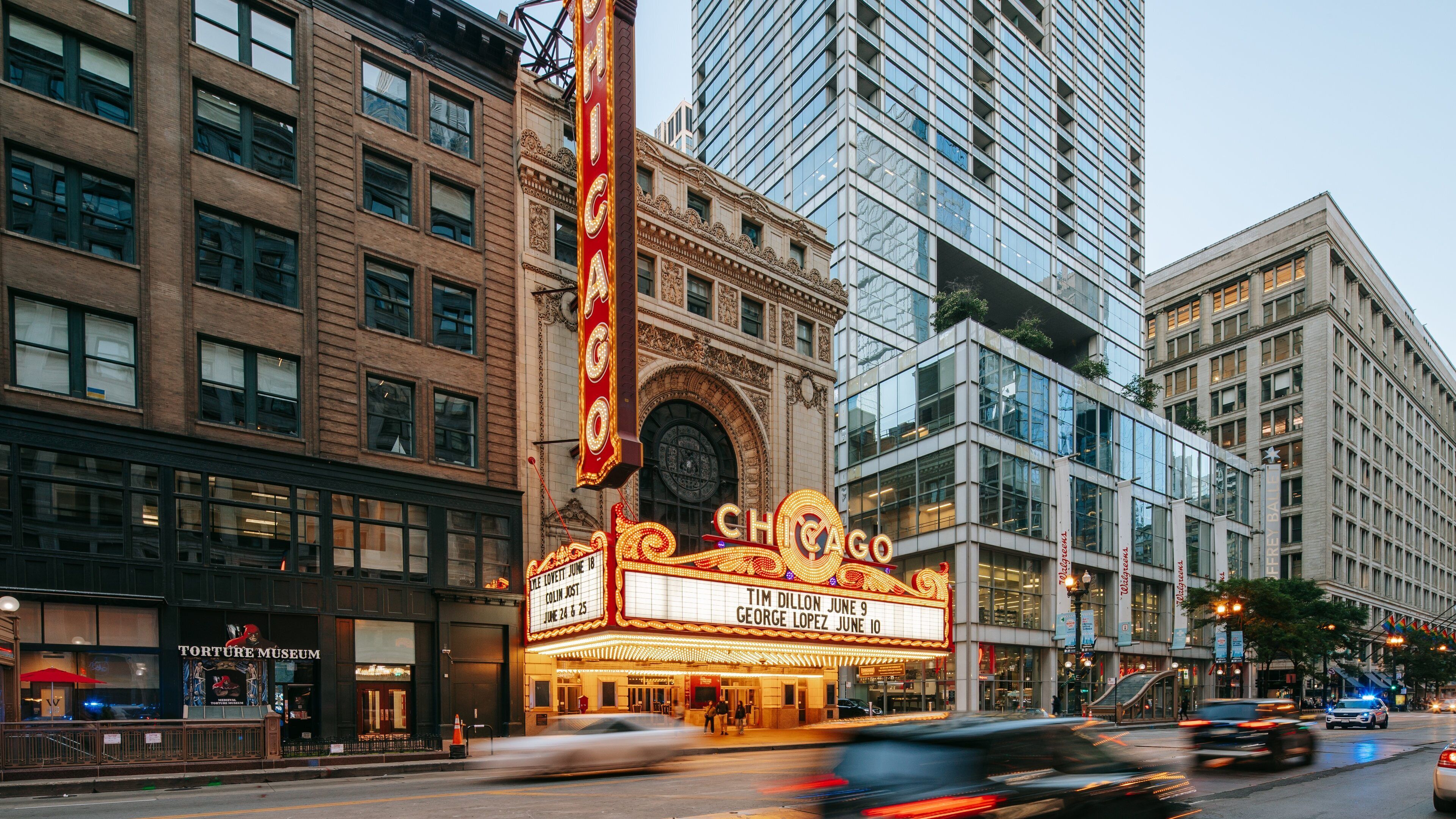 Chicago Theatre featuring a city, signage and street scenes