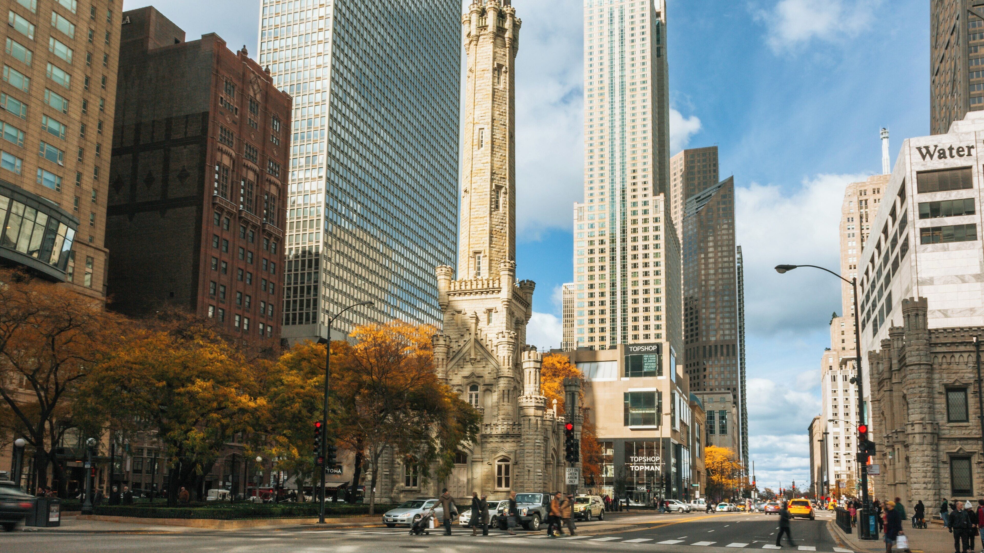 Chicago Water Tower stands prominently amidst skyscrapers on the Magnificent Mile showcasing urban architecture and vibrant city life