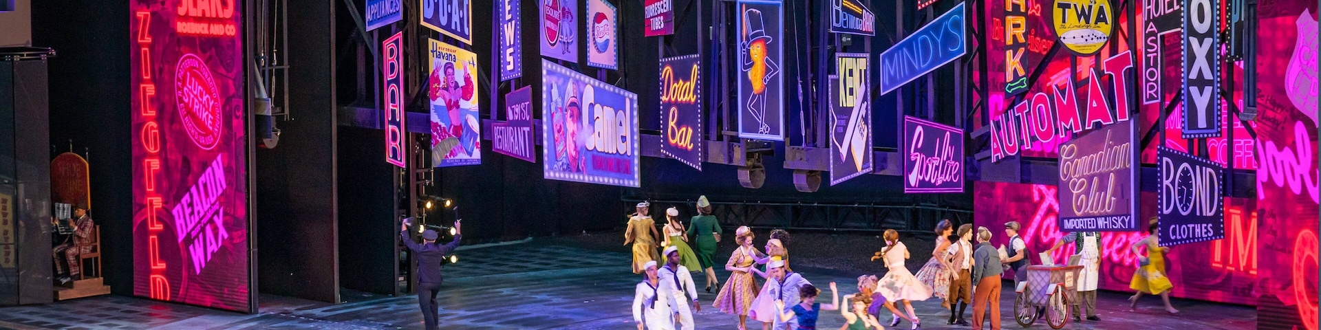 The Muny Theater featuring theater scenes and performance art as well as a small group of people