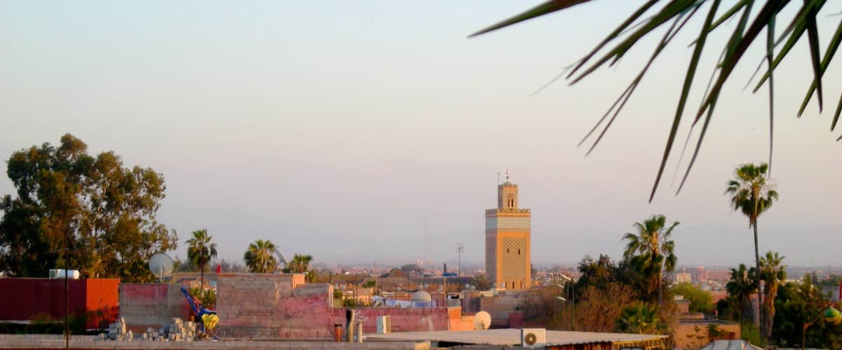 Koutoubia Minaret featuring a city and a sunset