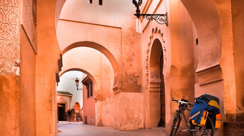 mountain bike standing near a red wall in the Muslim city of Marrakech in the street with beautiful arches and walls, ornamented tiles.; Shutterstock ID 184584899