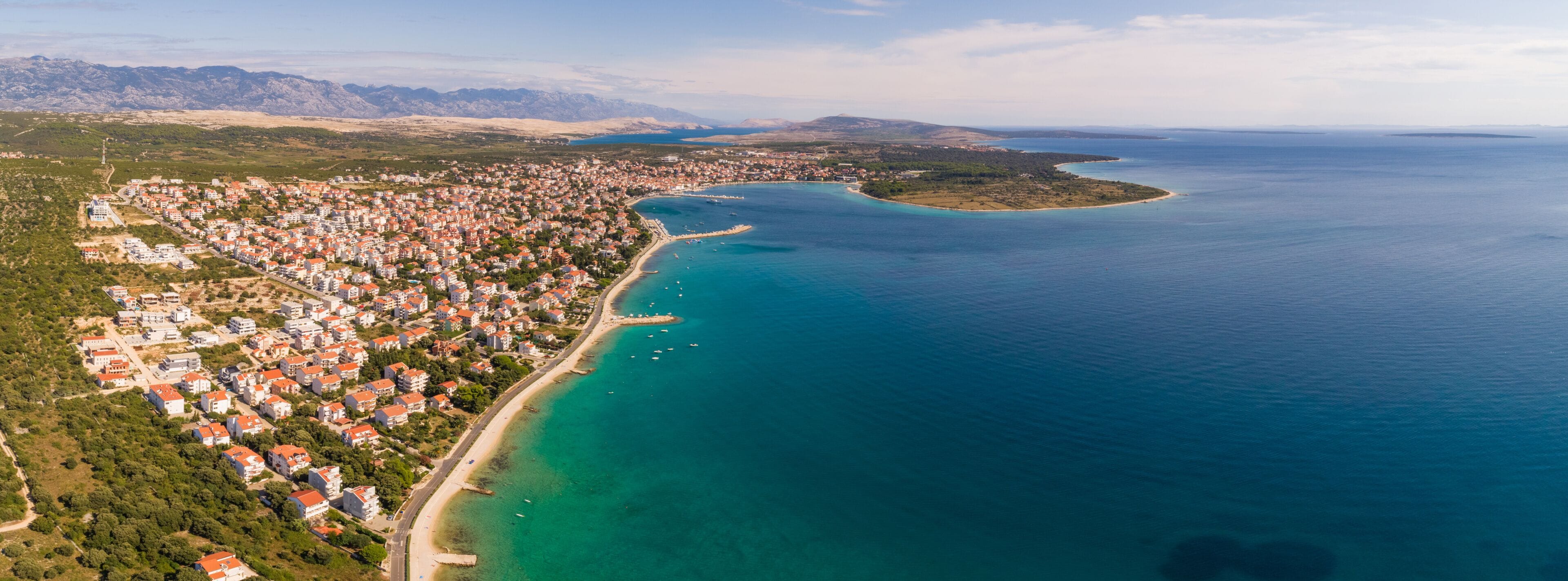 Panoramic aerial view of Novalja coastal line during the summer, island Pag, Croatia.