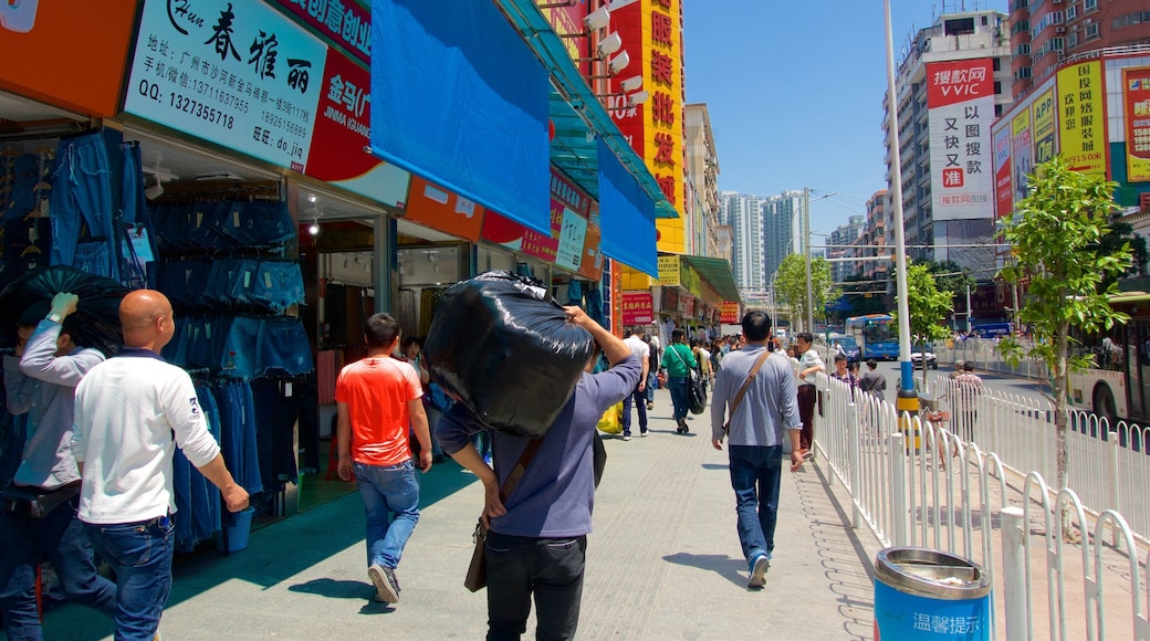 Tianhe showing a city as well as a small group of people