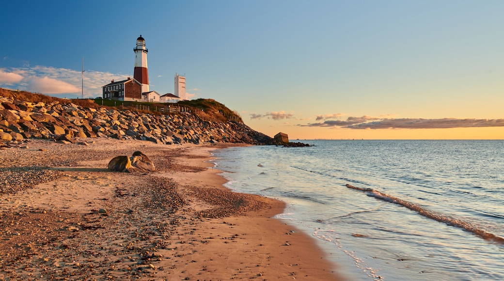 Montauk Lighthouse and beach at sunrise, Long Island, New York, USA.