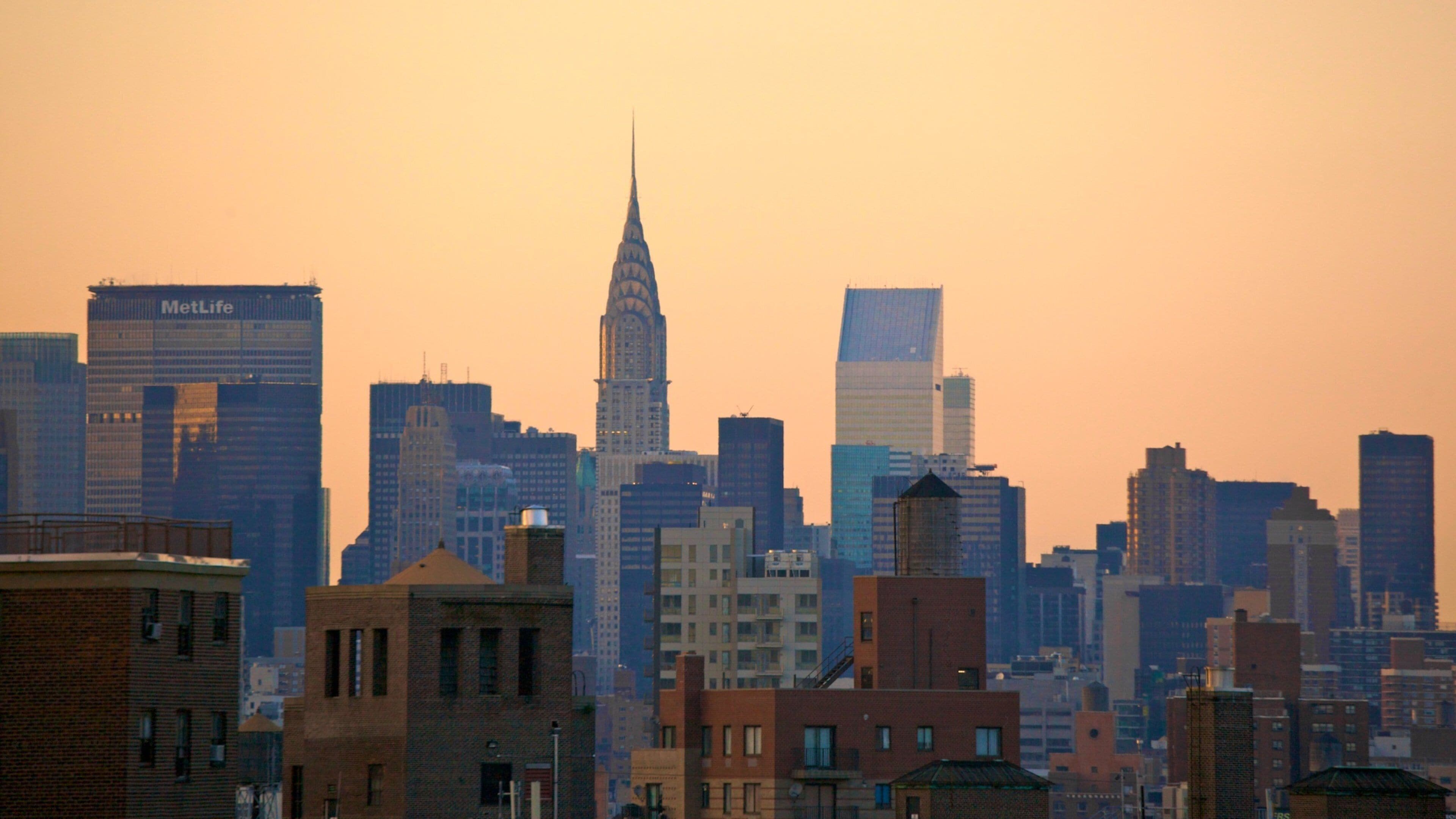 Chrysler Building featuring a city, a sunset and landscape views