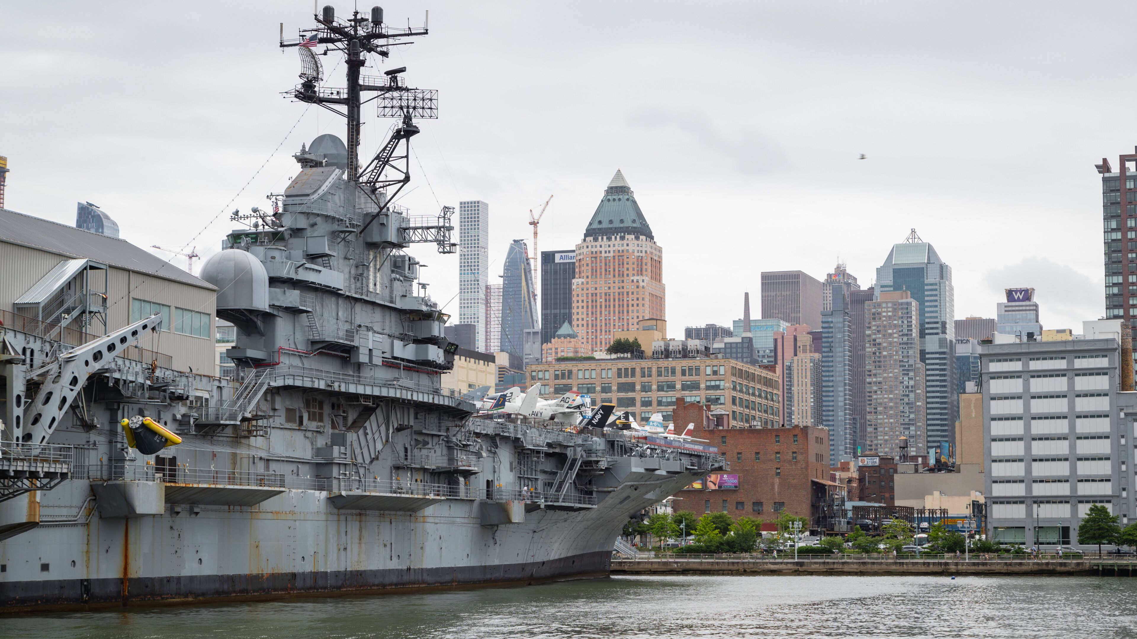 Intrepid Sea, Air and Space Museum featuring military items, a city and a marina