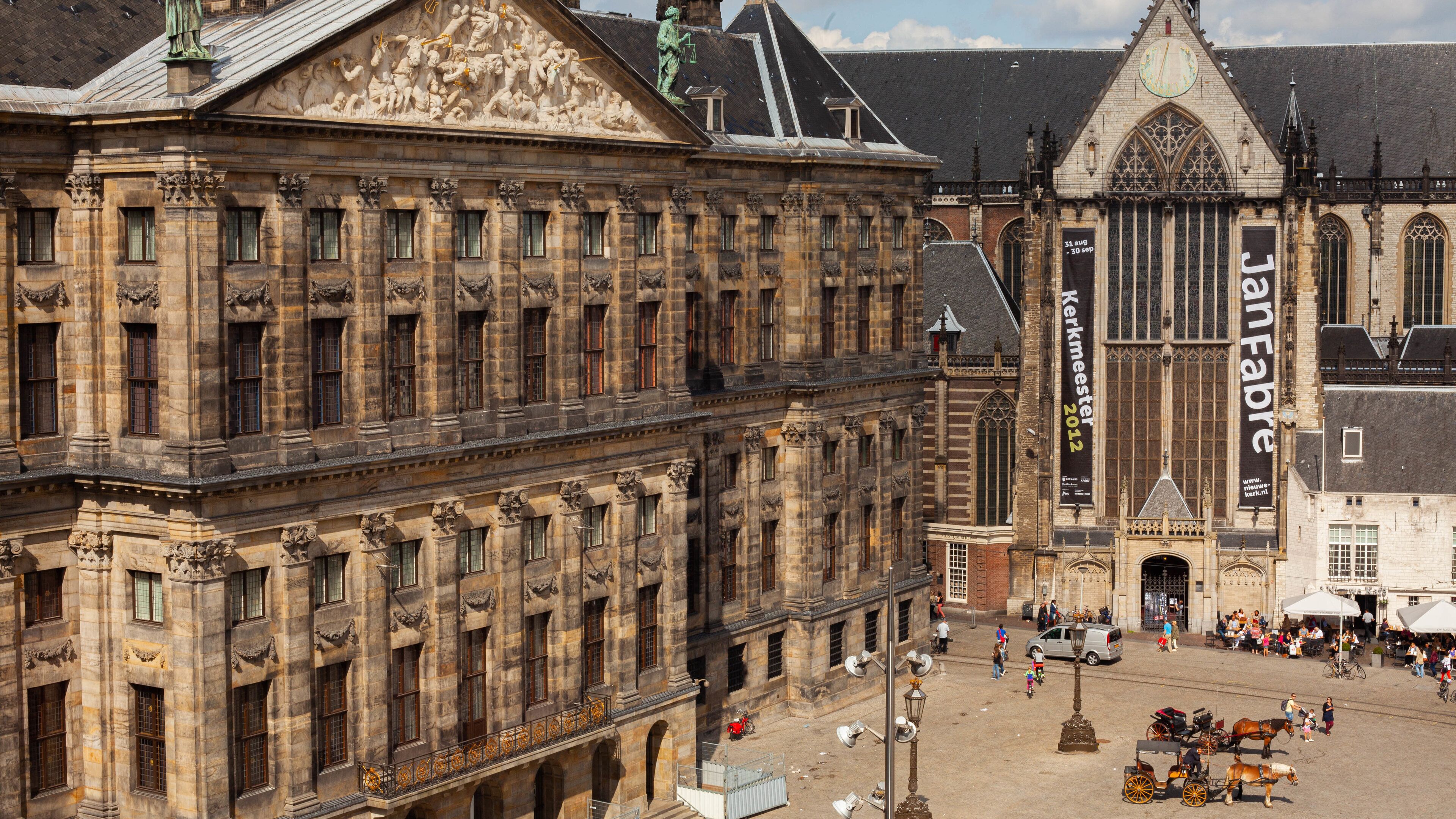 Dam Square featuring heritage architecture and a city