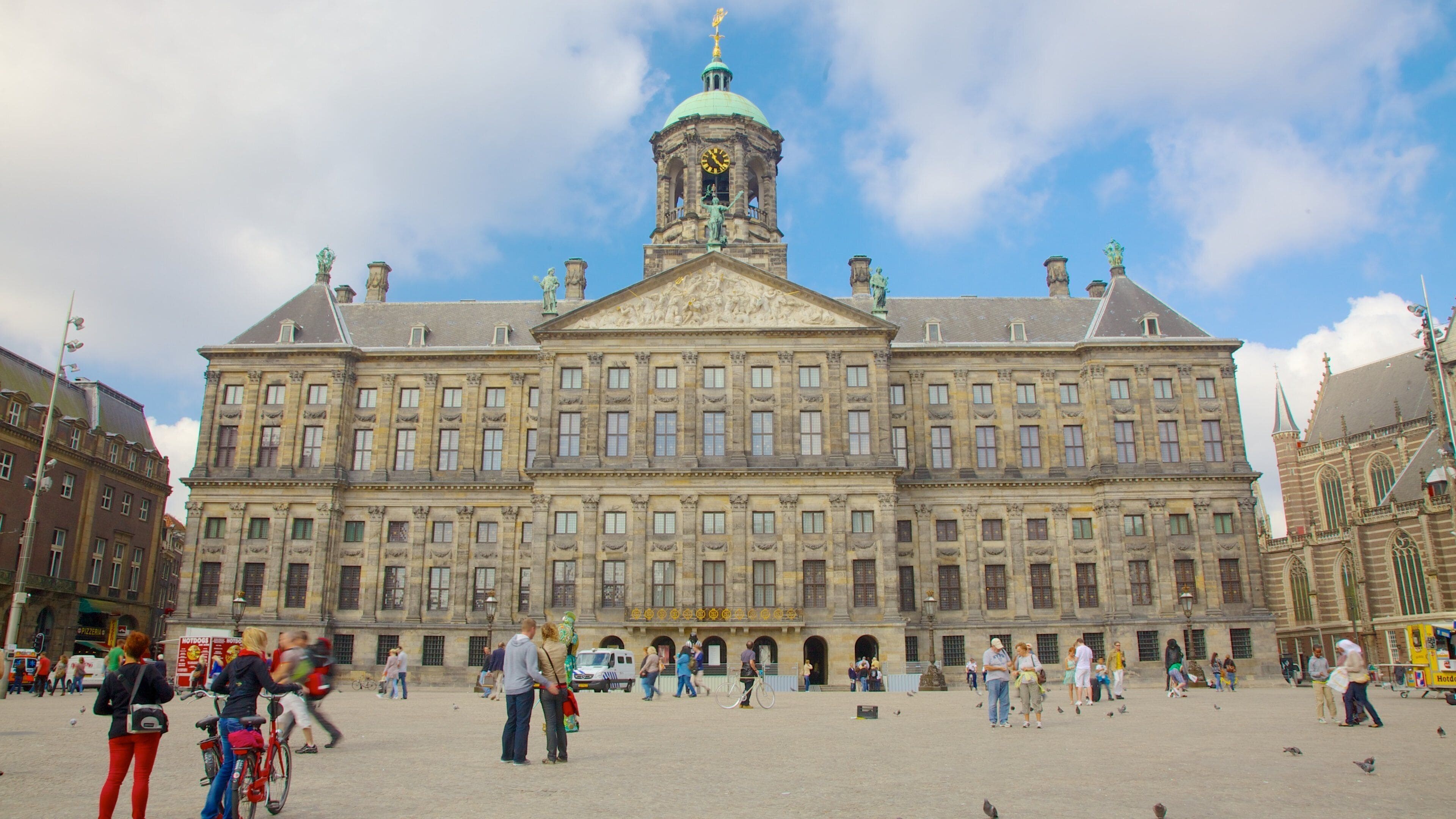 A large historic building with a clock tower and a dome.