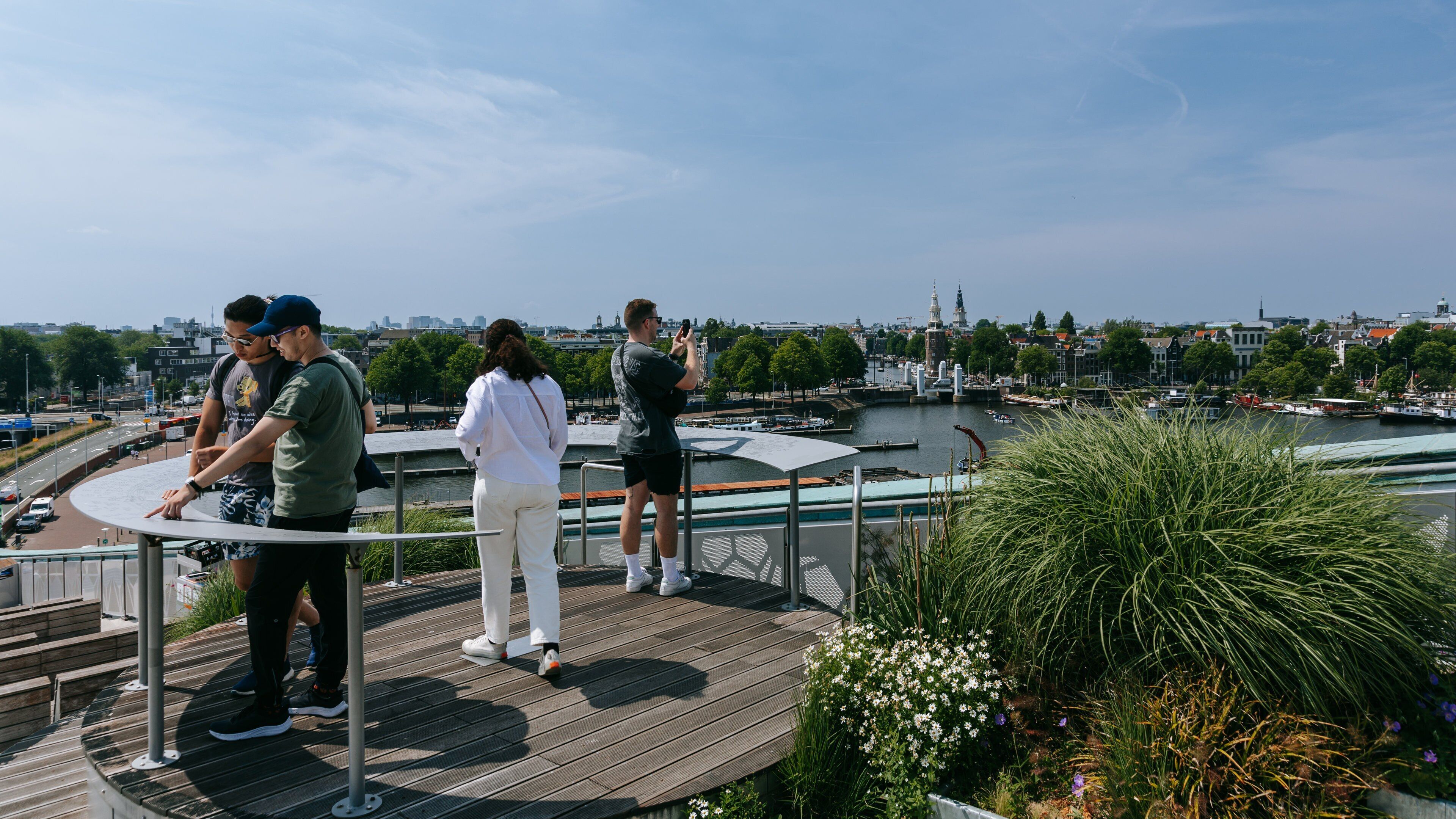 Nemo Science Museum which includes a bay or harbor and views