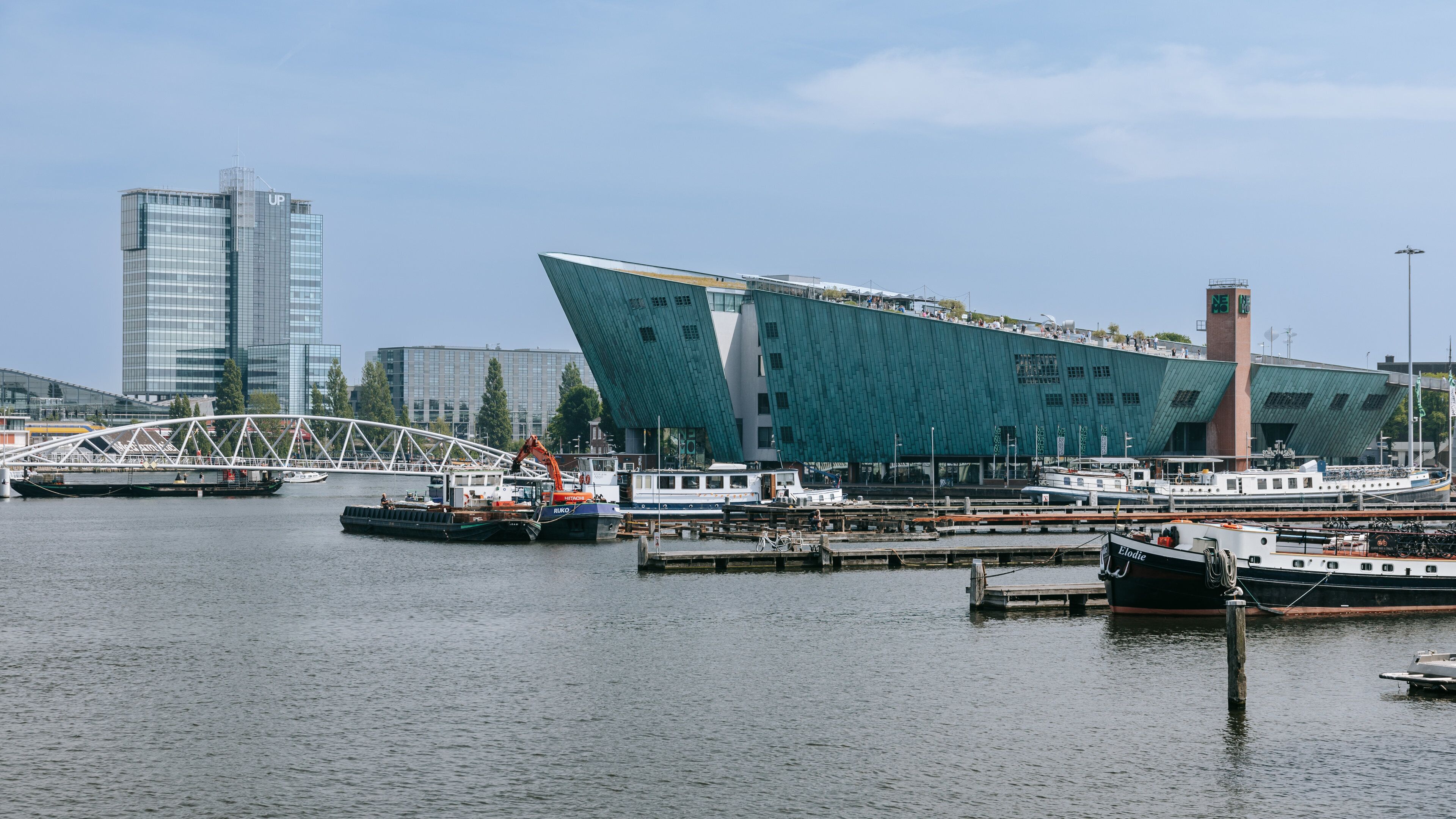 Nemo Science Museum showing modern architecture and a bay or harbor