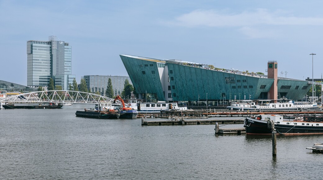 Nemo Science Museum showing modern architecture and a bay or harbor