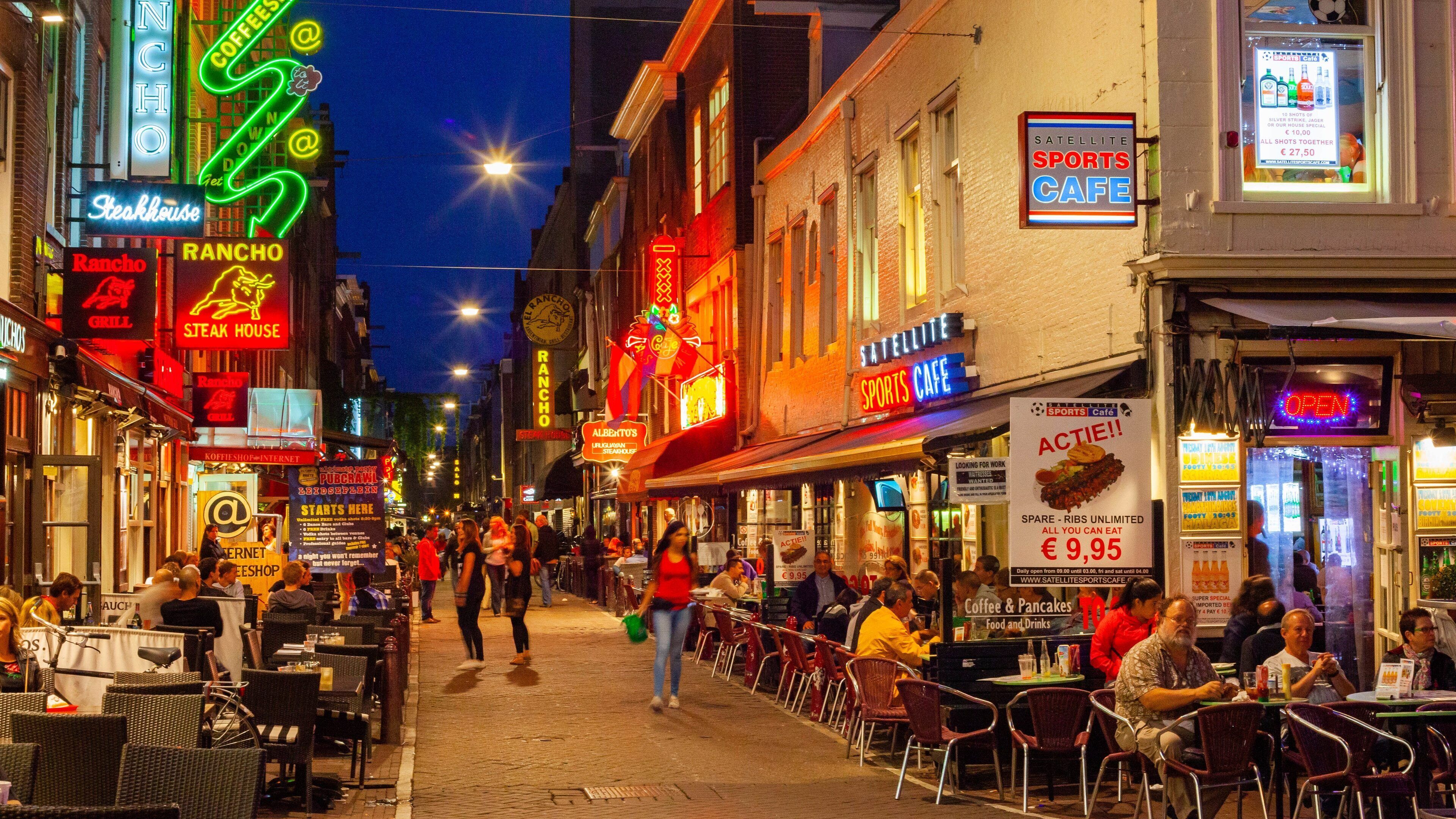 Leidseplein which includes a city, night scenes and street scenes