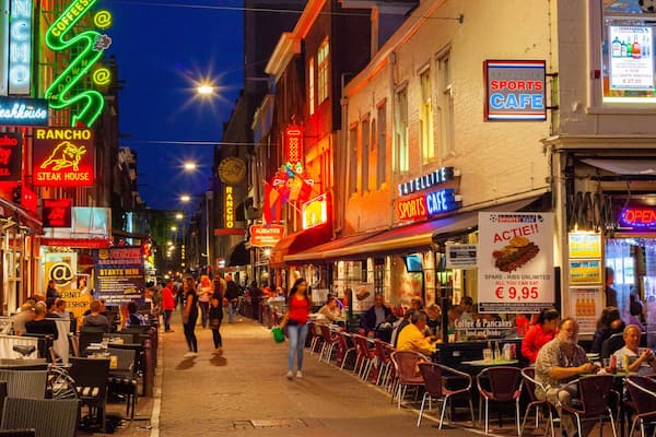 Leidseplein which includes a city, night scenes and street scenes