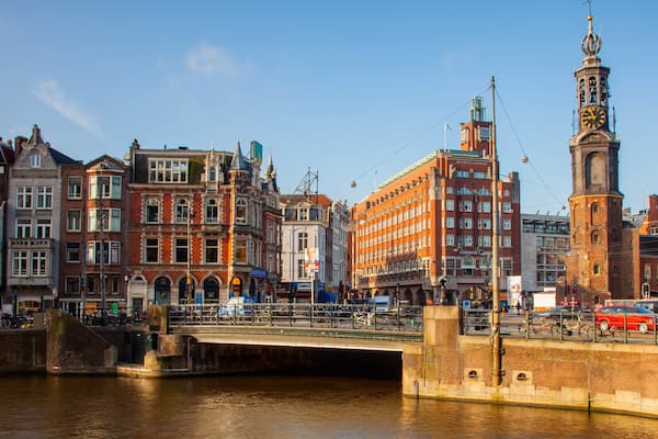 Muntplein showing a bridge, a river or creek and a city