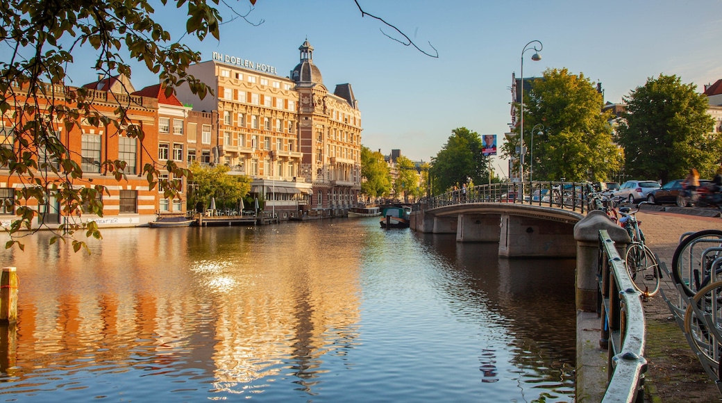 Muntplein which includes a river or creek, a bridge and a city