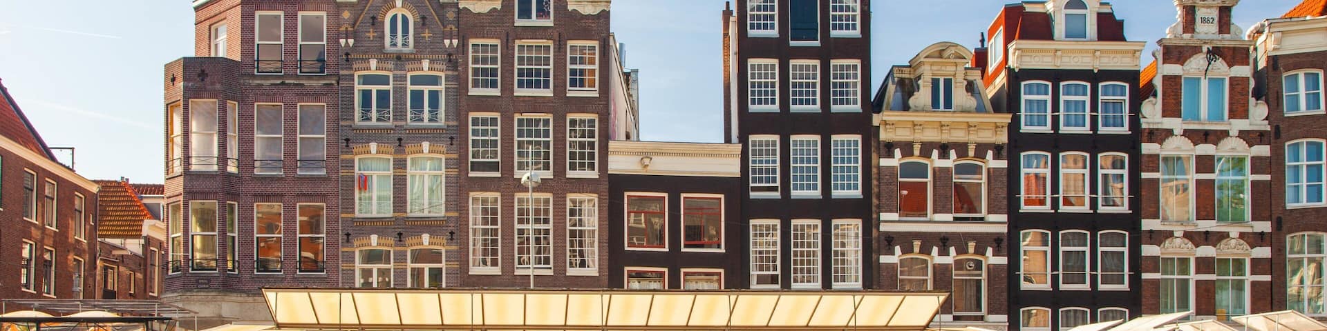 A canal with historic buildings and a flower market.