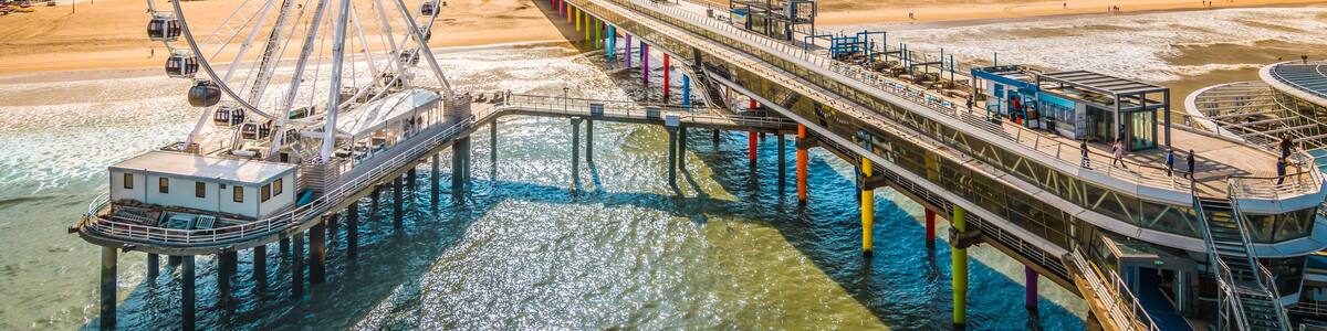 Scheveningen, The Hague, The Netherlands. Ferris wheel and pier at the beach.