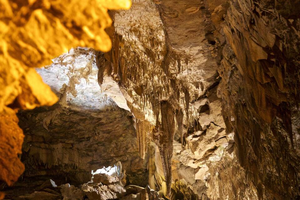 A cave interior with stalactites and stalagmites.