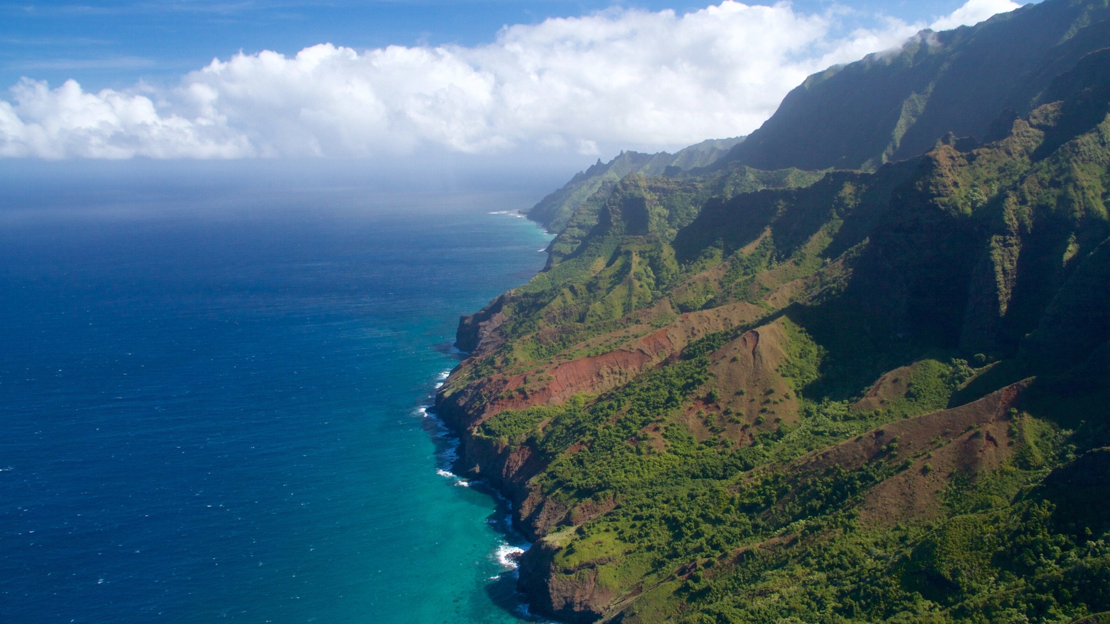Na Pali Coast State Park featuring mountains, a gorge or canyon and general coastal views